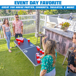 a group of people playing a game on a backyard table