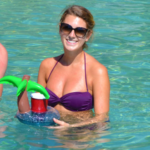 a woman in a purple bikini holding a water bottle