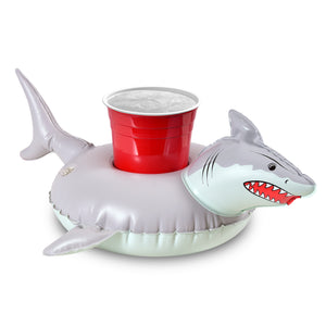 a plastic shark with a cup on it