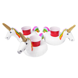 a white tea set with a unicorn head and a rainbow colored handle