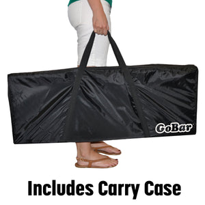a woman carrying a black bag with the words, in the middle of the bag
