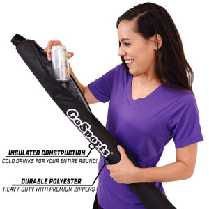 a woman holding a black and white bag
