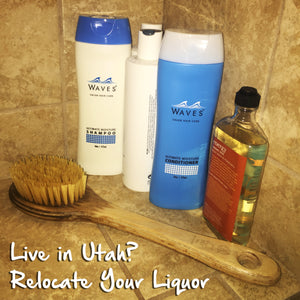 a wooden brush and a bottle of water and a toothbrush