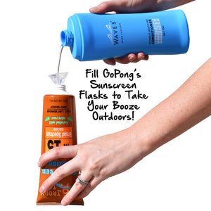 a person holding a bottle of sunscreen