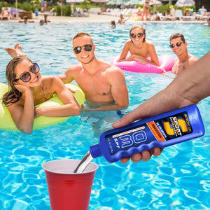 a man is holding a bottle of sunscreene in the pool